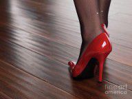 2266008_Woman_In_Red_High_Heels_Walking_On_Hardwood_Floor