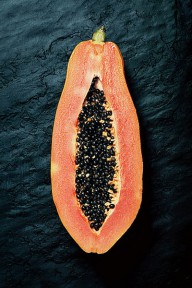21717696 papaya-cross-section-on-dark-slate-johan-swanepoel