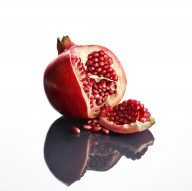 11389353 pomegranate-opened-up-on-reflective-surface-johan-swanepoel