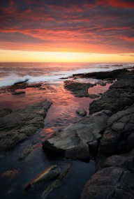 12242905 sunset-over-rocky-coastline-johan-swanepoel